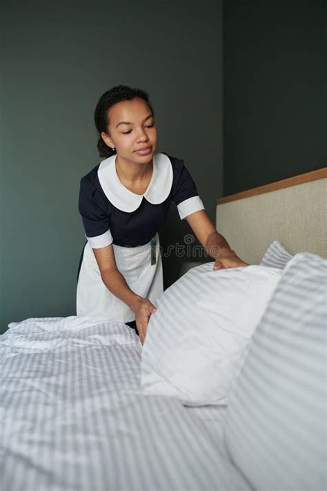 bending over the bed